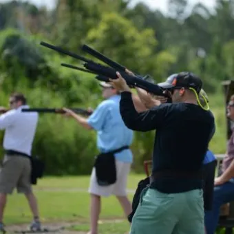 a group of people playing baseball on a field