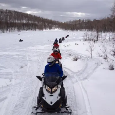 a person riding skis down a snow covered slope